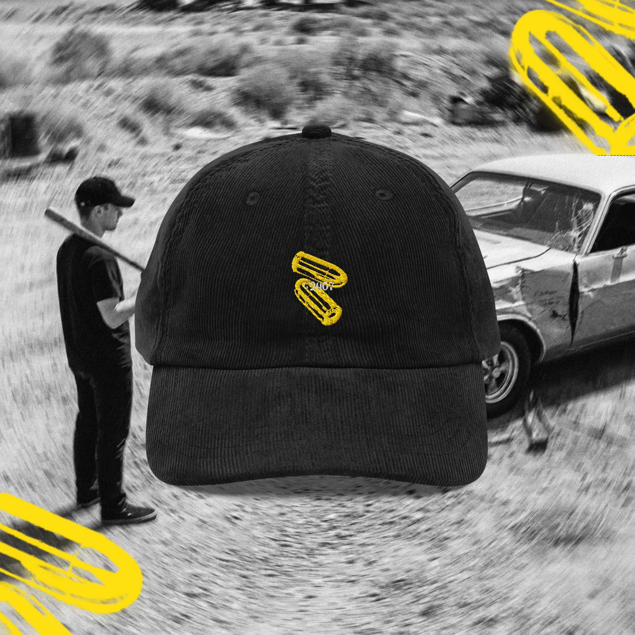 Black cap with two yellow bullet casings logo on a background of a person with a baseball bat facing a beaten up vintage classic mucle car dodge challenger.
