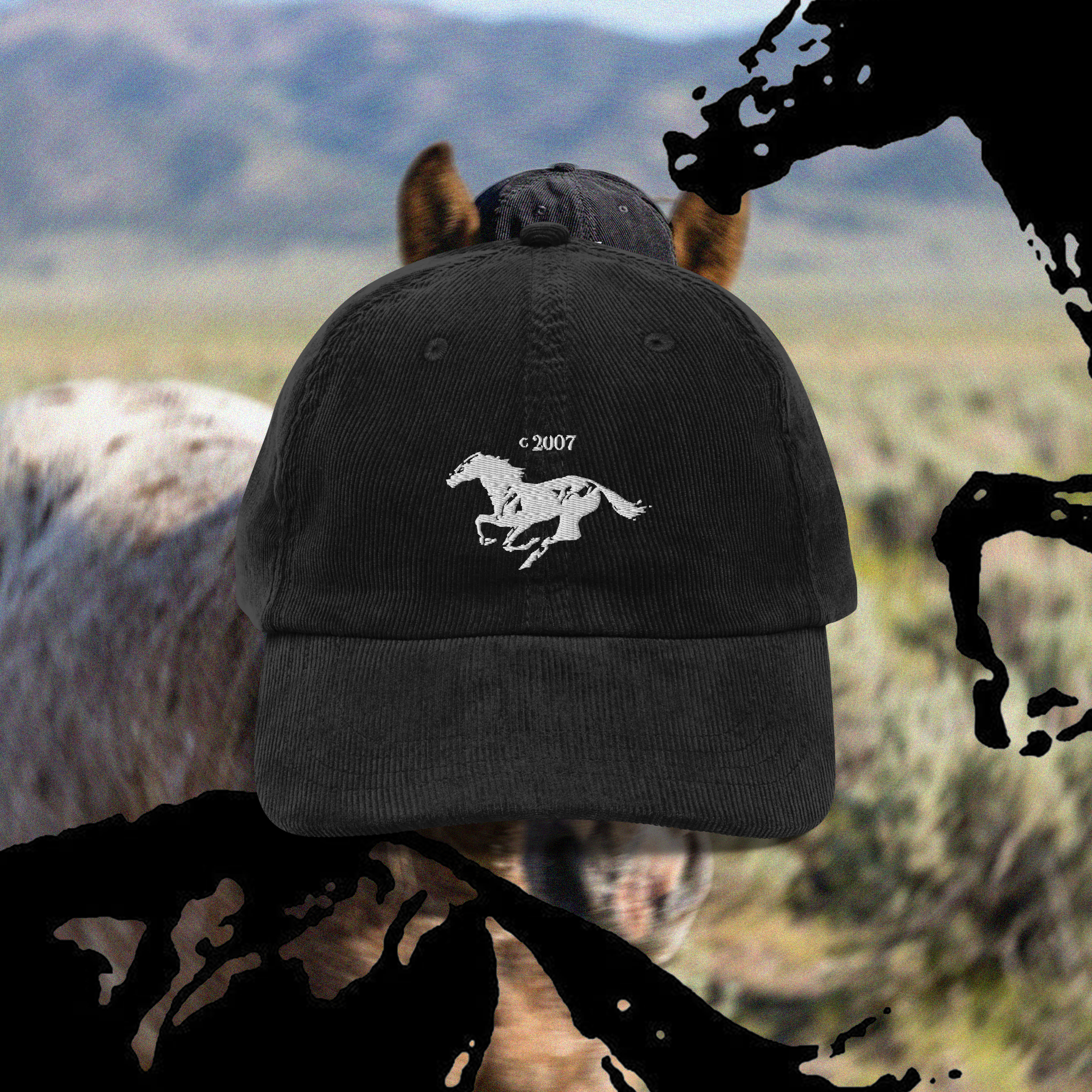 Black cap with a running mustang horse logo, on a blurred background.
