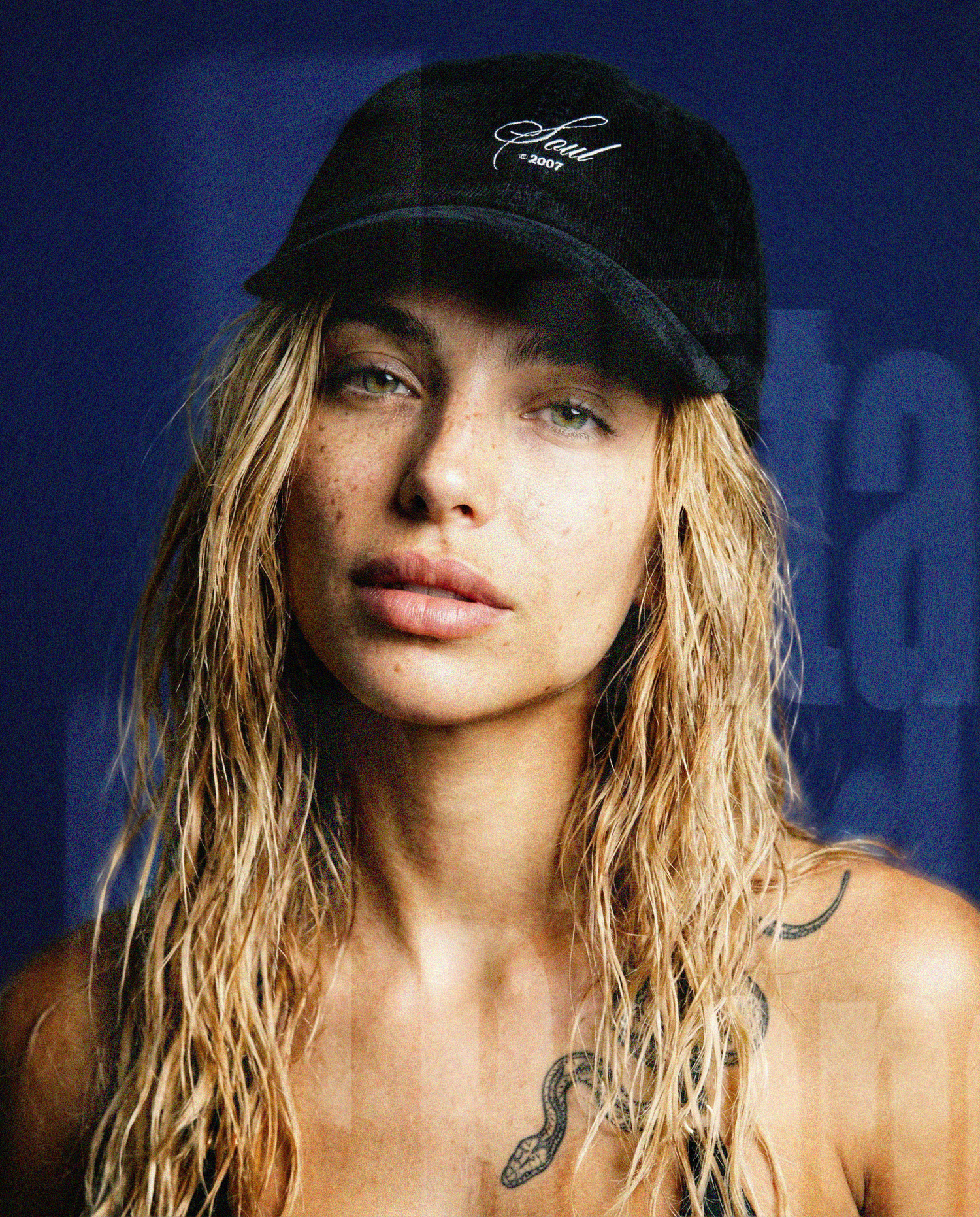 A beautiful blonde woman wearing a black cap with a logo that reads: "SOUL"